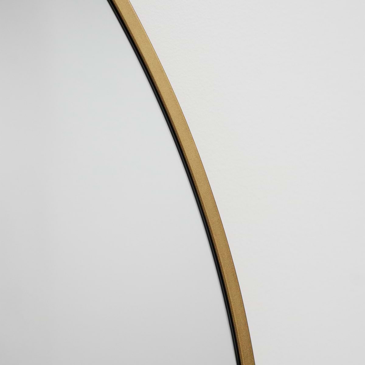 Gold Full Length Arched Metal Mirror detail shot of gold curved frame