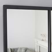 A detail of this mirrors stylish frame.
