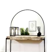 Black Wide Arched Metal Overmantle Mirror on console table
