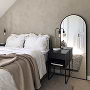 Black Full Length Arched Metal Mirror in bedroom