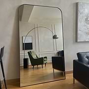 Full Length Black Curved Metal Extra Large Mirror as a living room lean to