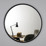 Black Metal Modern Round Wall Mirror on living room wall