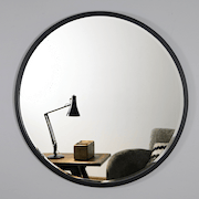 Black Metal Modern Round Wall Mirror reflecting lounge