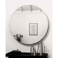 Large Frameless Round Wall Mirror reflecting painting