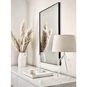 Black Rectangular Metal Wall Mirror beside ceramics