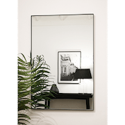 Black Rectangular Metal Wall Mirror opposite painting