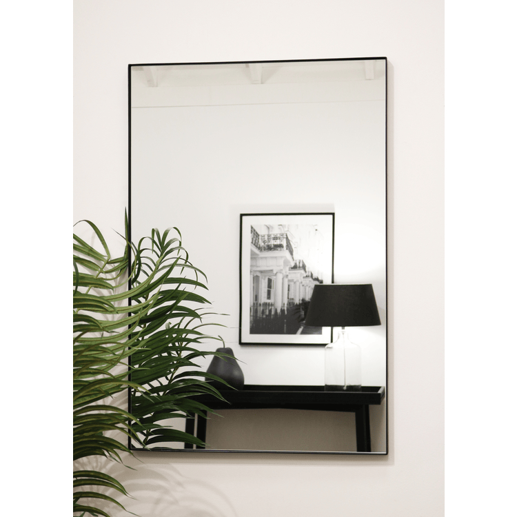 Black Rectangular Metal Wall Mirror opposite painting