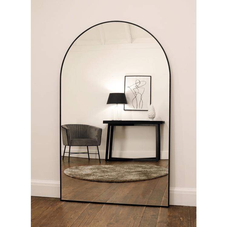 Black Full Length Arched Metal Mirror reflecting lounge