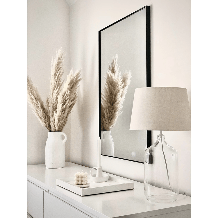 Black Rectangular Metal Wall Mirror beside ceramics