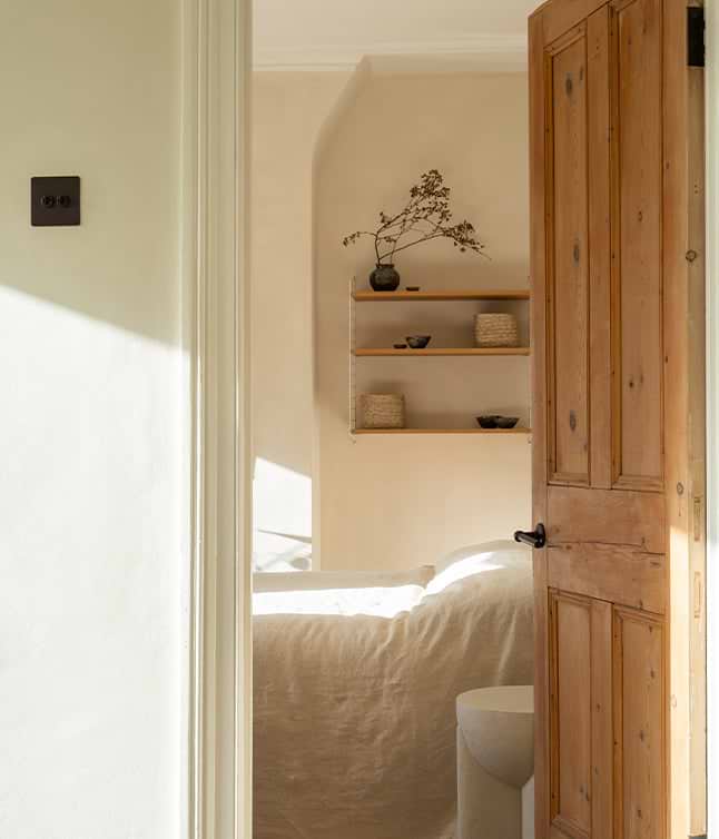 Contemporary living space with wooden features and bronze light switches