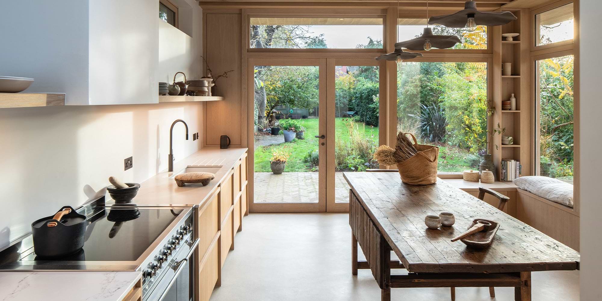 Contemporary kitchen with large paned windows and lots of wooden accents