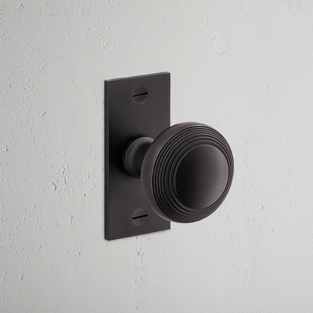 Poplar Short Plate Sprung Door Knob - Bronze