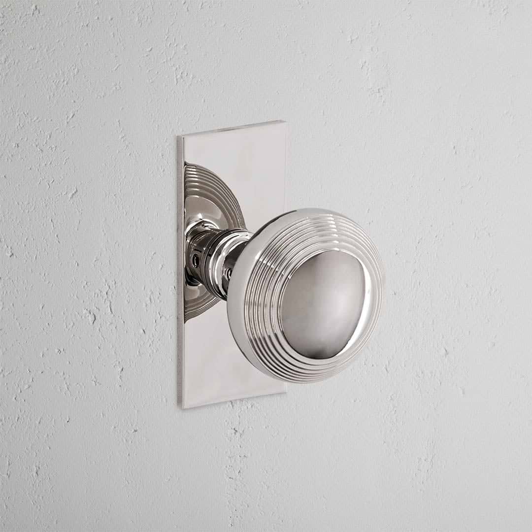 Poplar Short Plate Sprung Door Knob - Polished Nickel