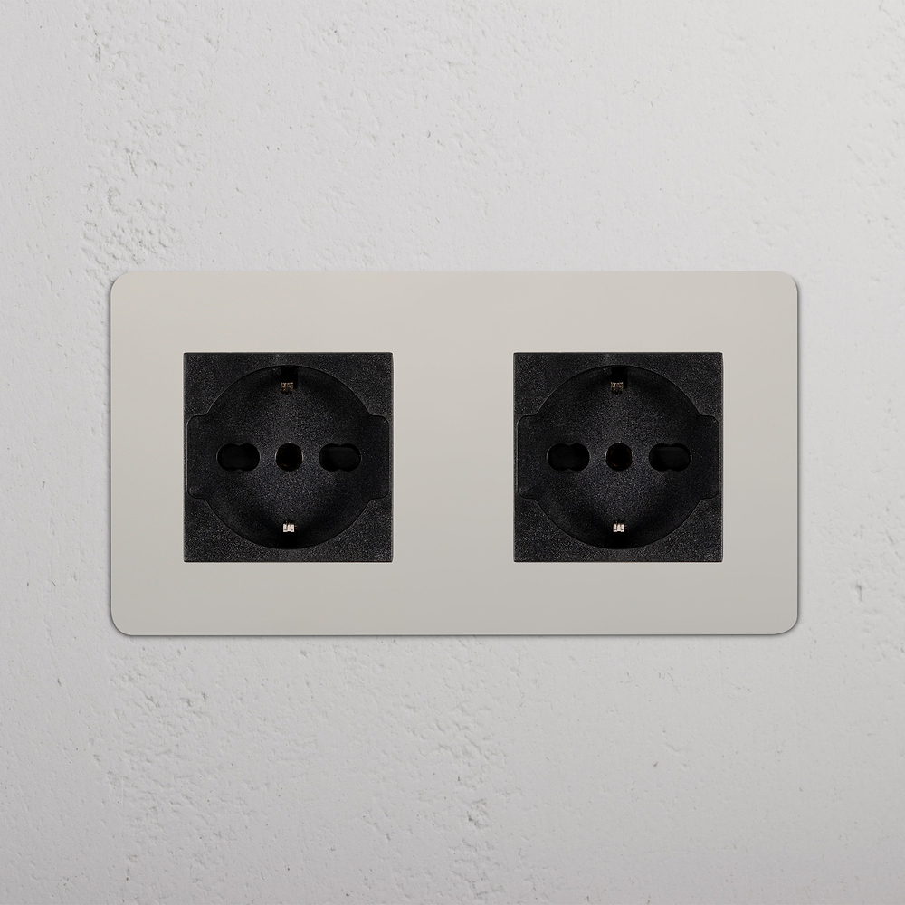 Kew Enchufe Schuko/Bipasso x2 (marco doble) - Níquel pulido | Negro