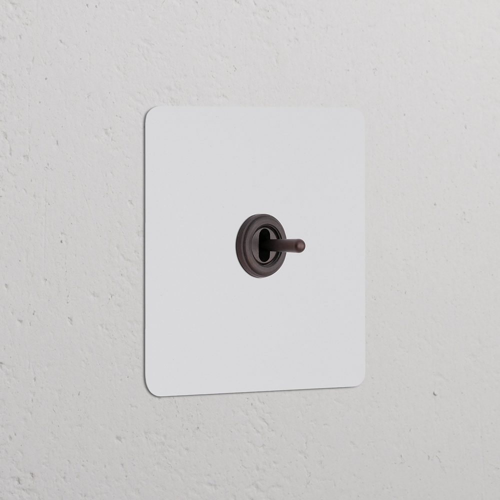 Kew Single Centre Retractive Toggle Switch - Paintable Bronze
