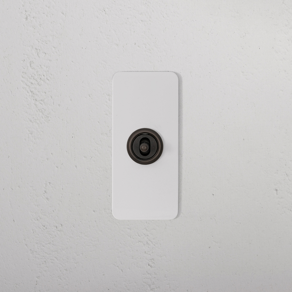 1G Architrave Centre Retractive Toggle Switch - Paintable Bronze
