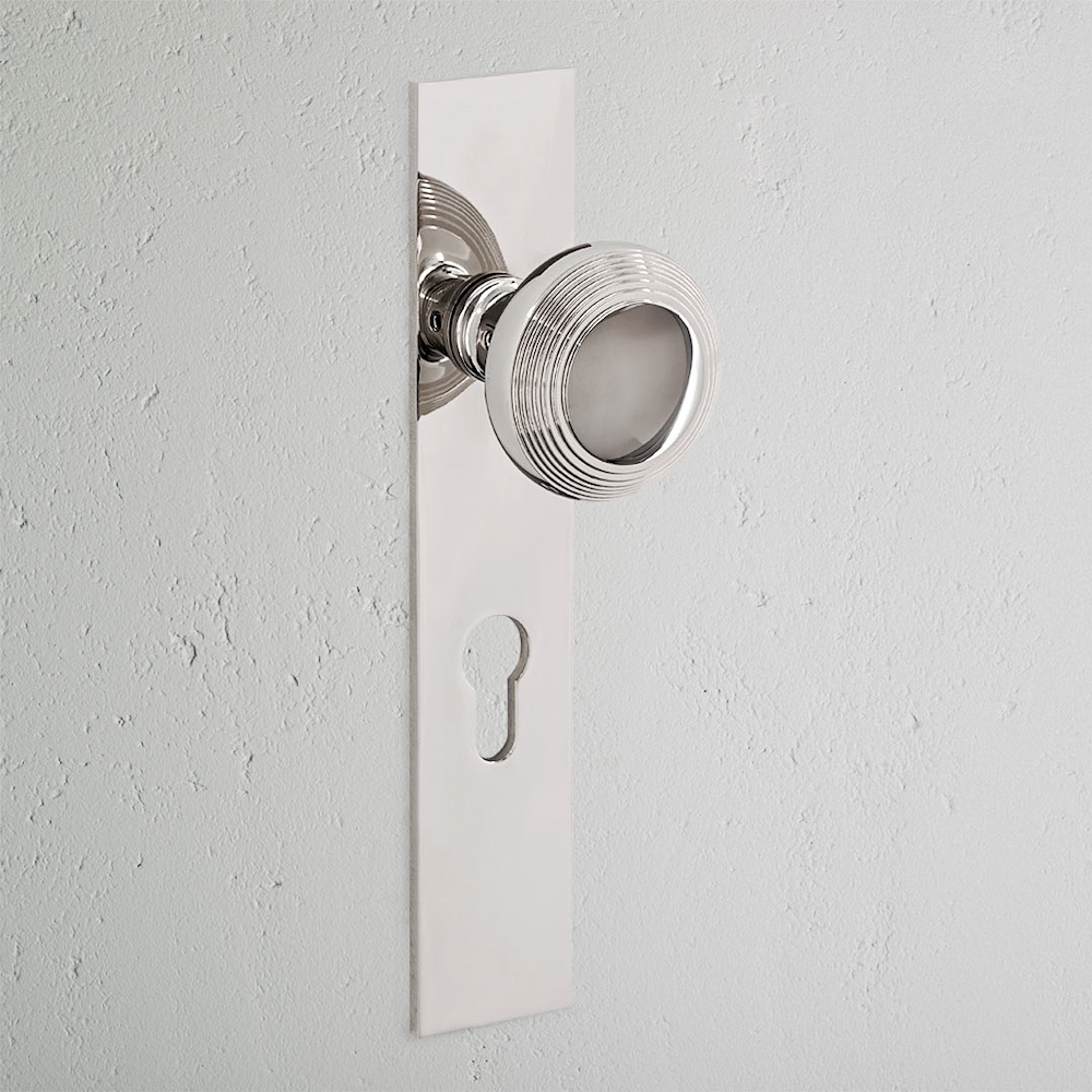 Poplar Long Plate Sprung Door Knob & Euro Lock - Polished Nickel