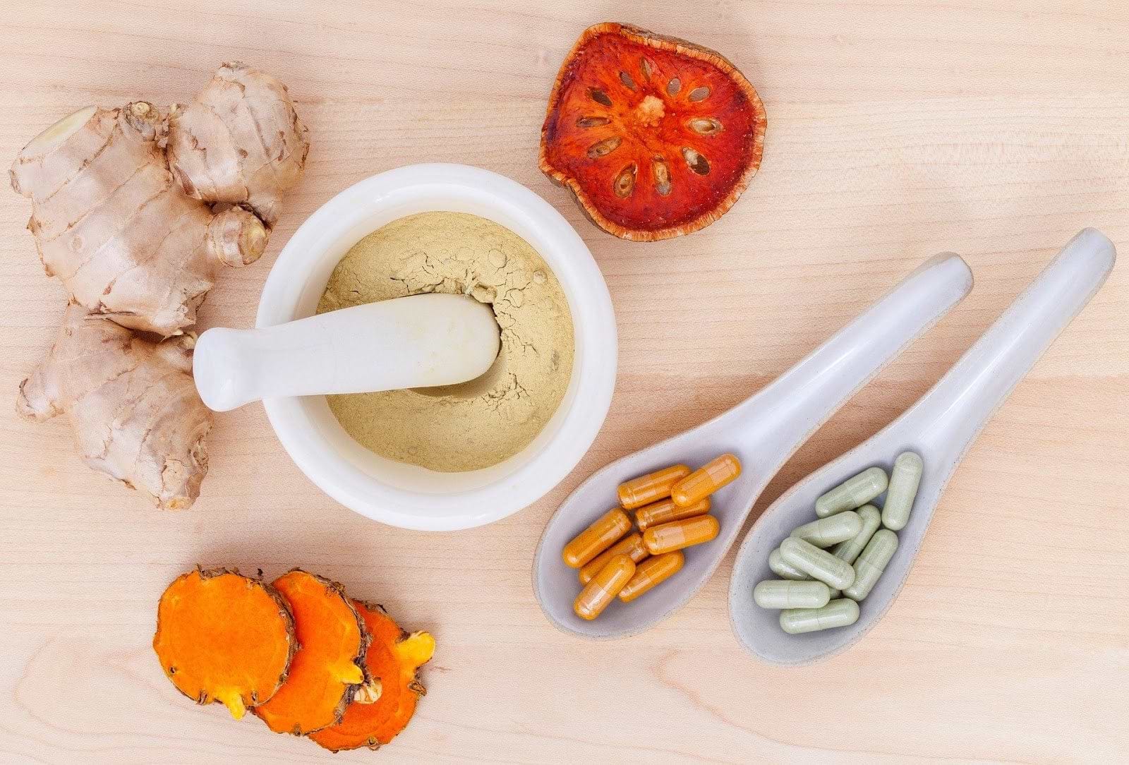 Supplements for inflammation: herbs in a mortar and pestle