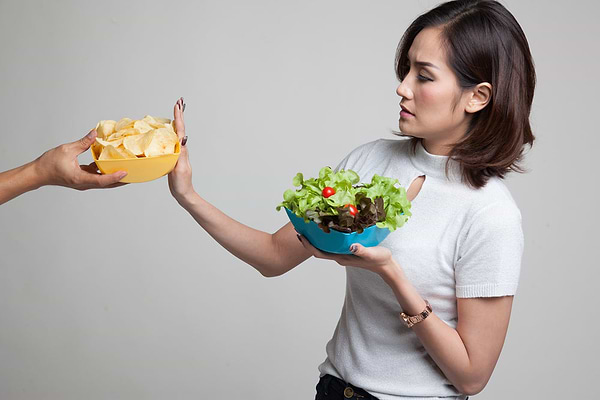Asian woman saying no to bad foods