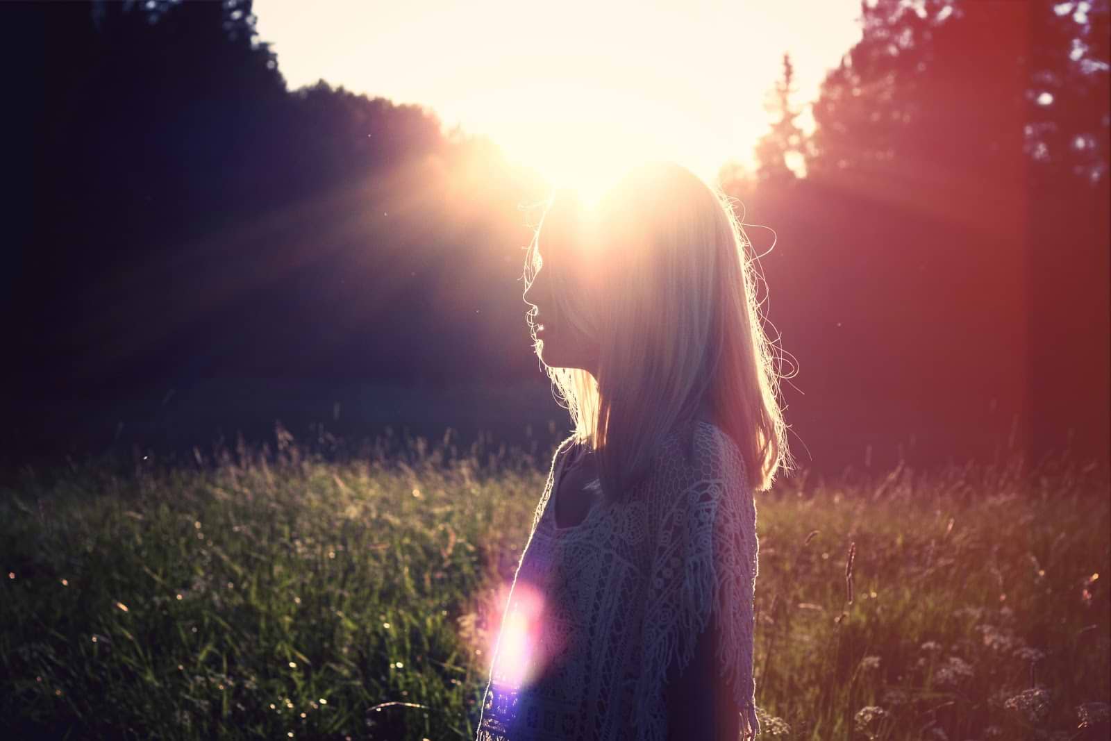 Menopause supplements: A woman stands in the sun to absorb vitamin D