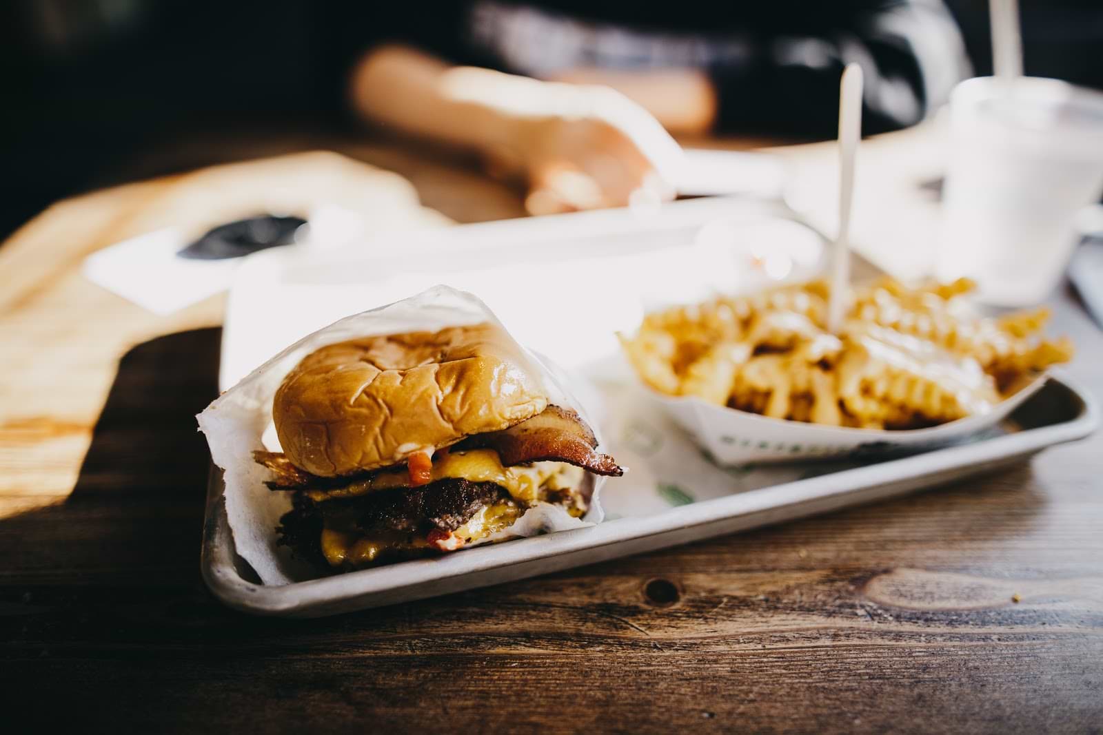 A tray with a burger and fries