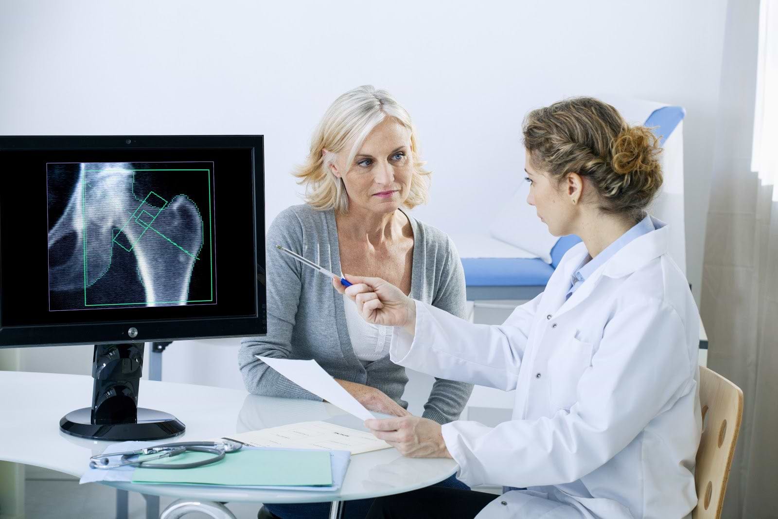 Benefits of kefir: Woman and female doctor with a computer X-ray