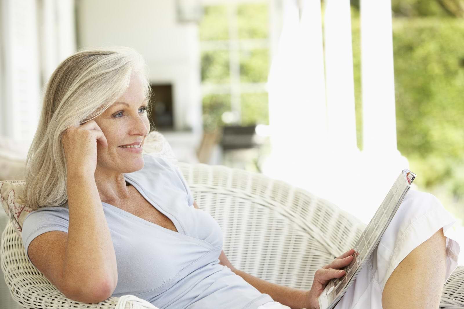 woman smiling sitting porch