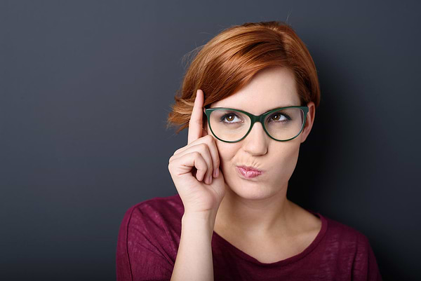 Young woman thinking about what a gut cleanse is and whether she needs it