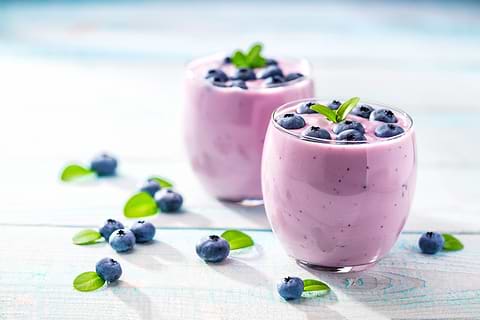 yogurt and berries help deal with a distended stomach