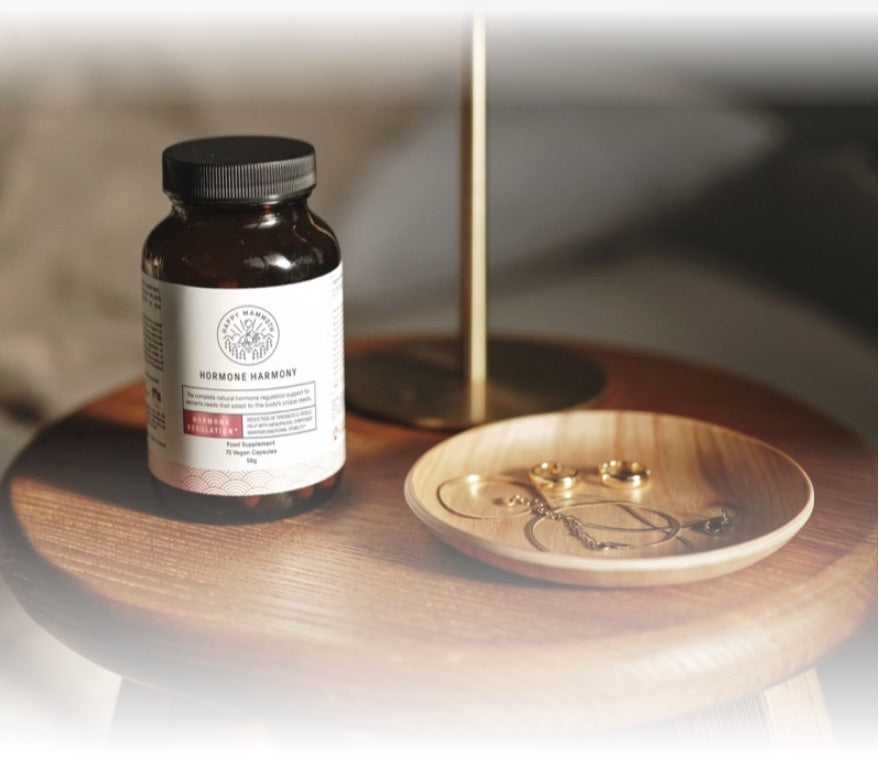 Hormone Harmony bottle on a bedside table