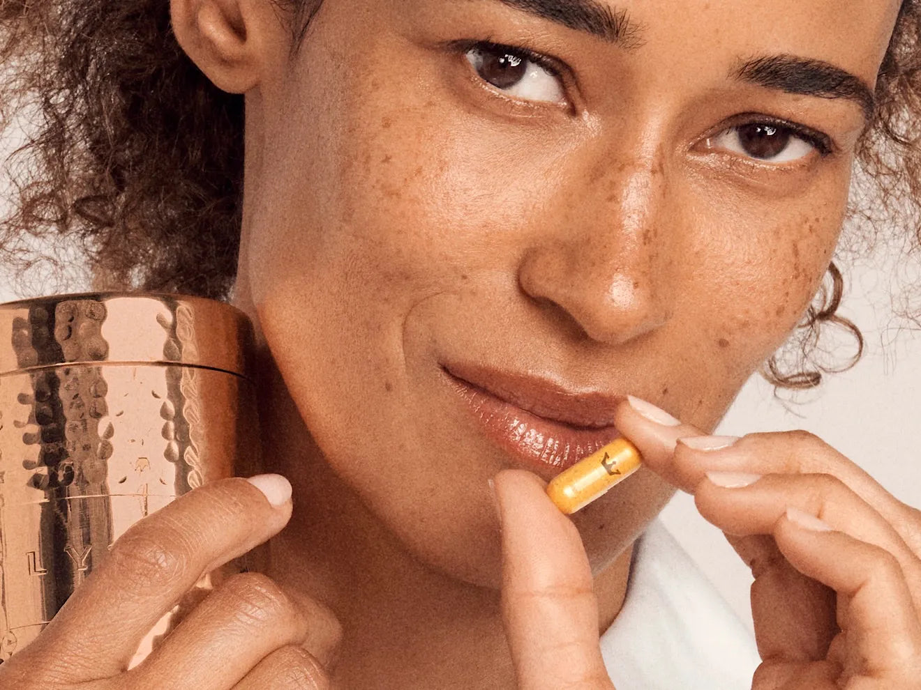 woman swallows LYMA yellow pill
