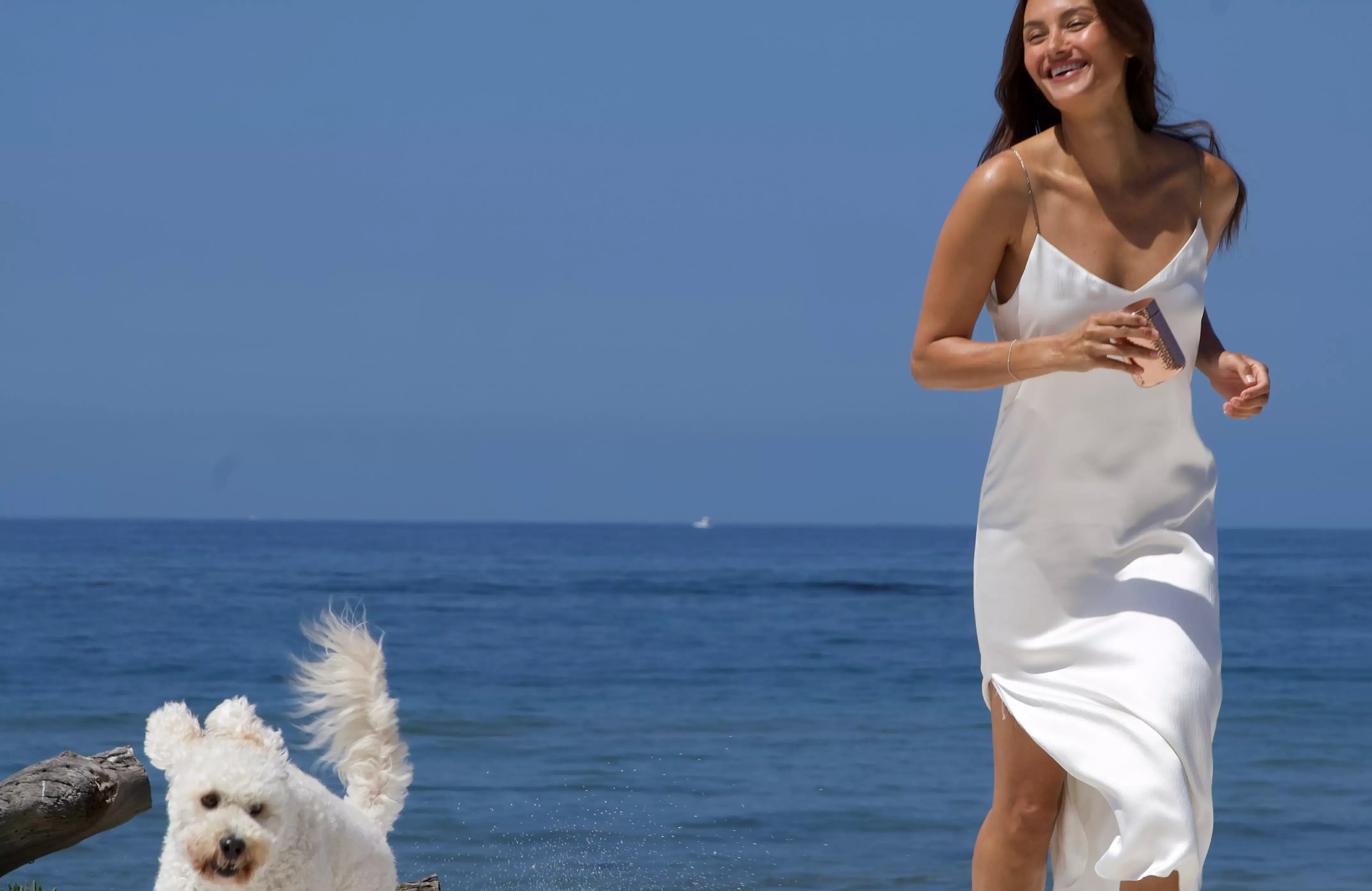 Woman and dog on beach