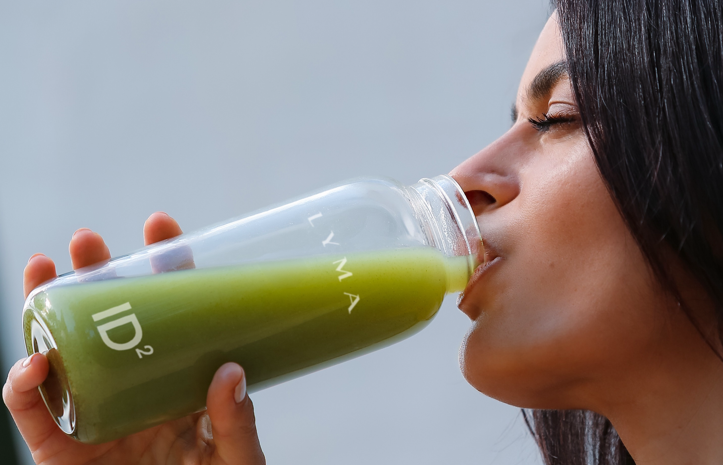 Woman drinks ID2 to replenish her minerals