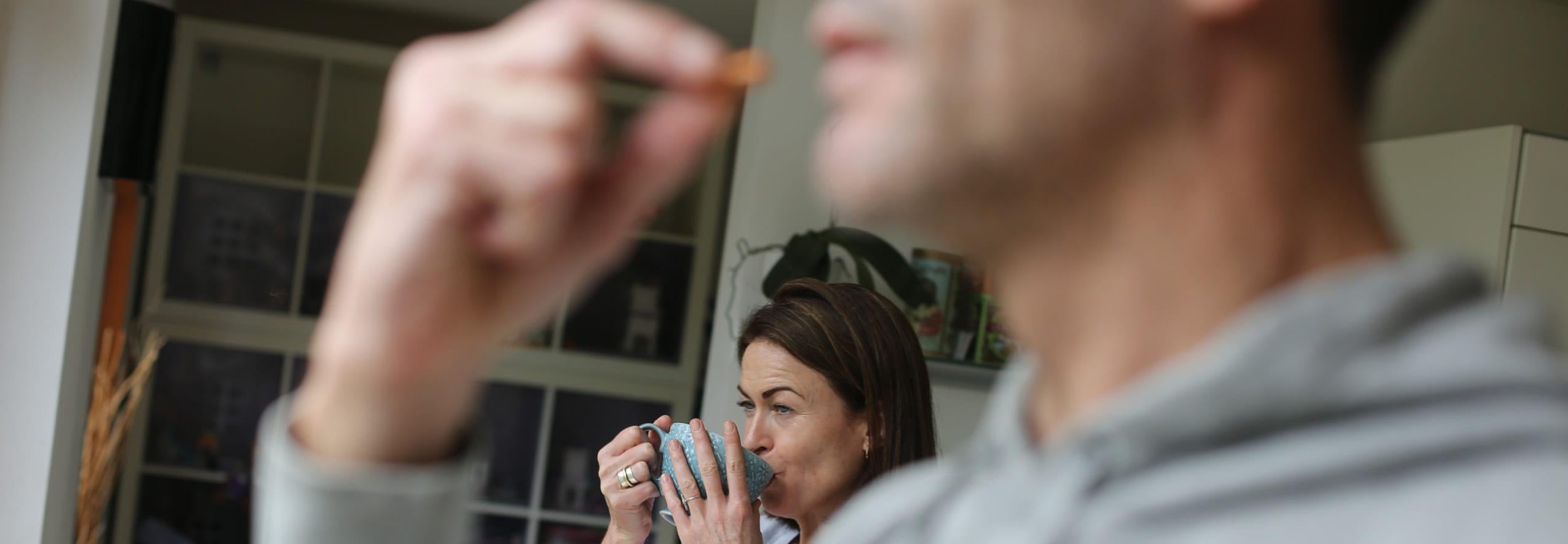 woman and man with tea and vitamins