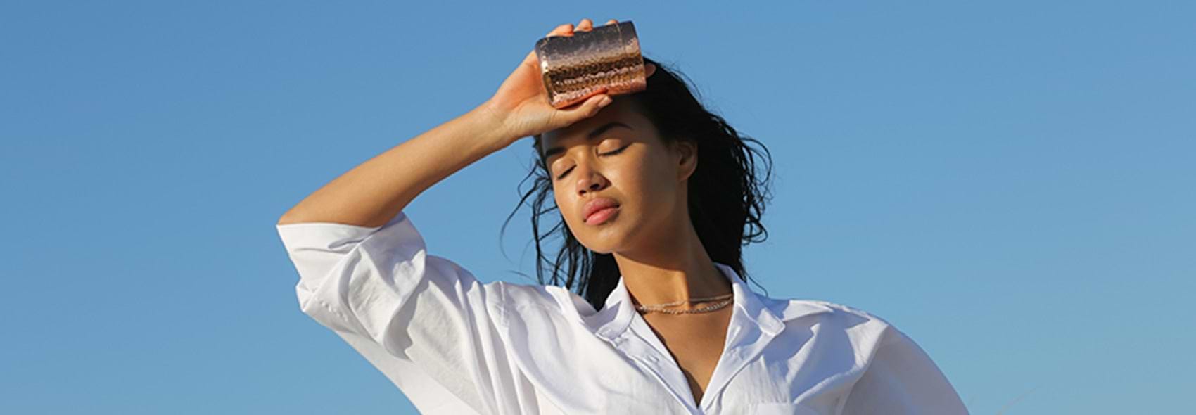 VESSEL EYES CLOSED WOMAN IN SUN