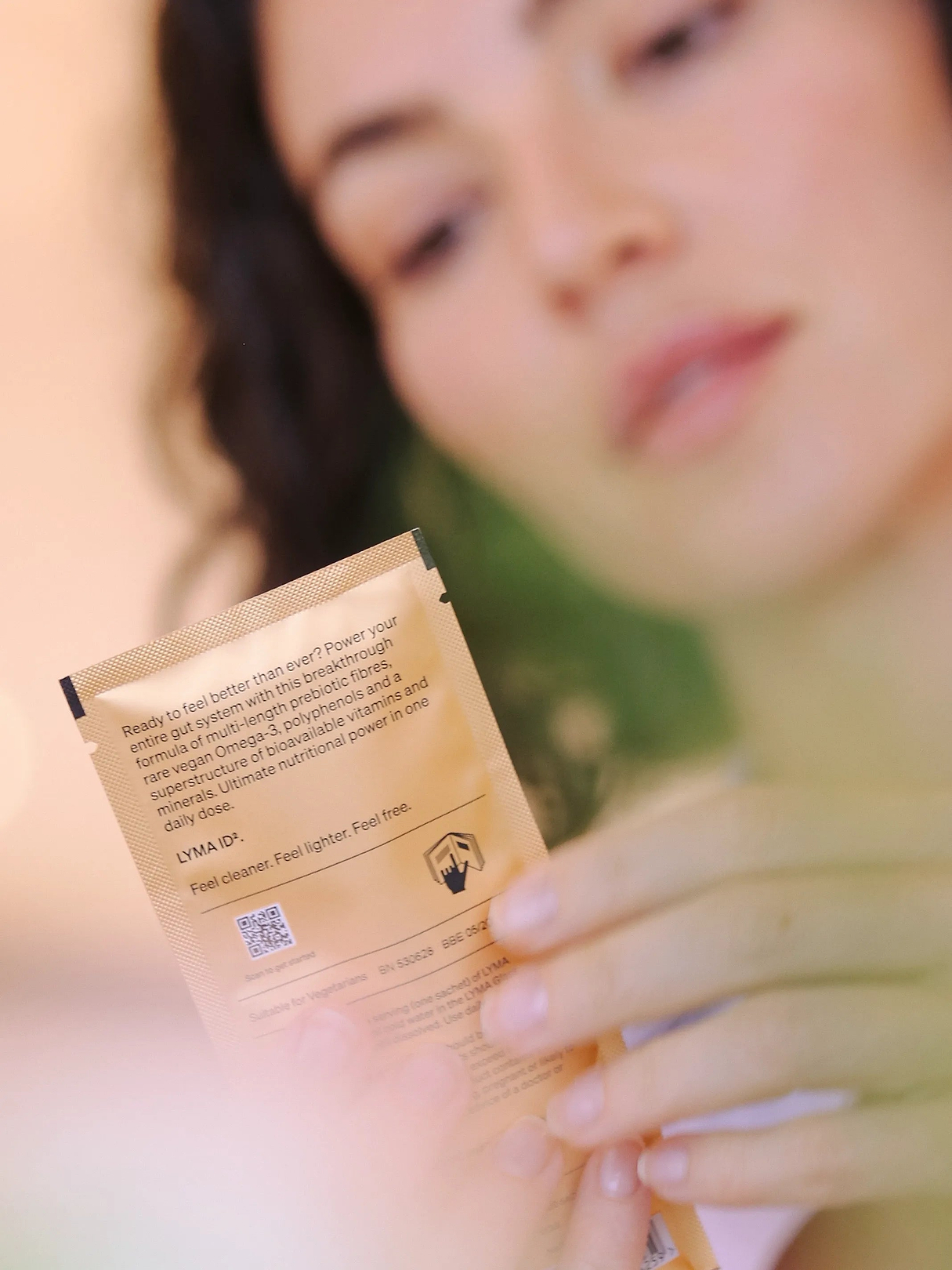 Woman face with ID2 pouch - gut health powder