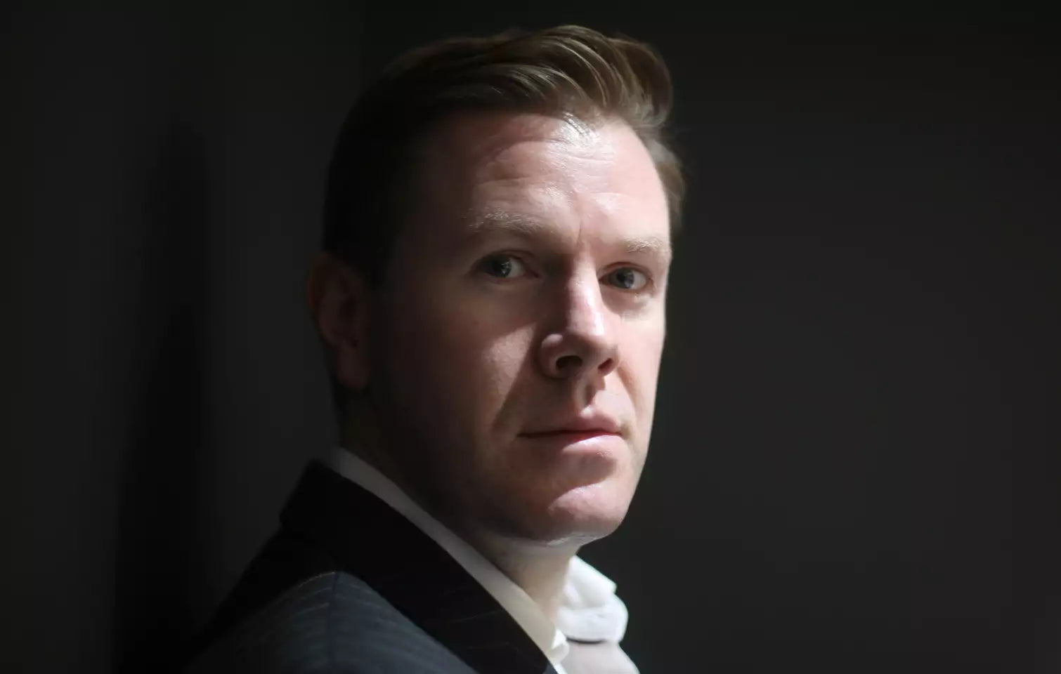 Portrait of Dr Graeme Glass explaining LYMA laser technology