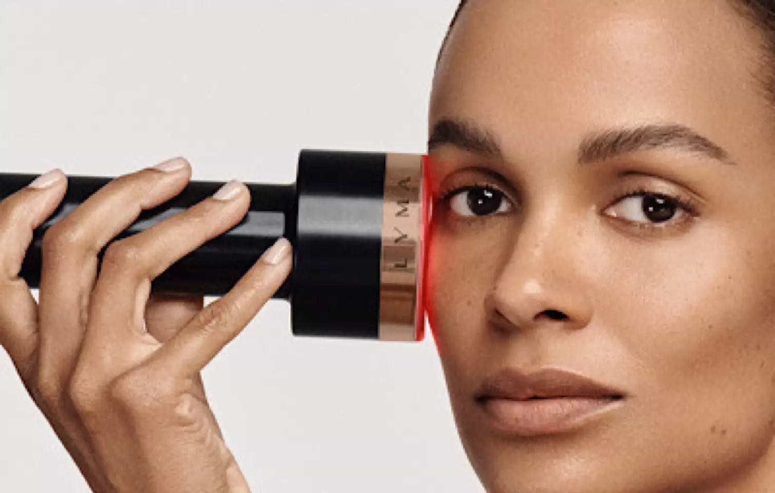 Model with LYMA Laser PRO device in studio demonstrating skin tightening