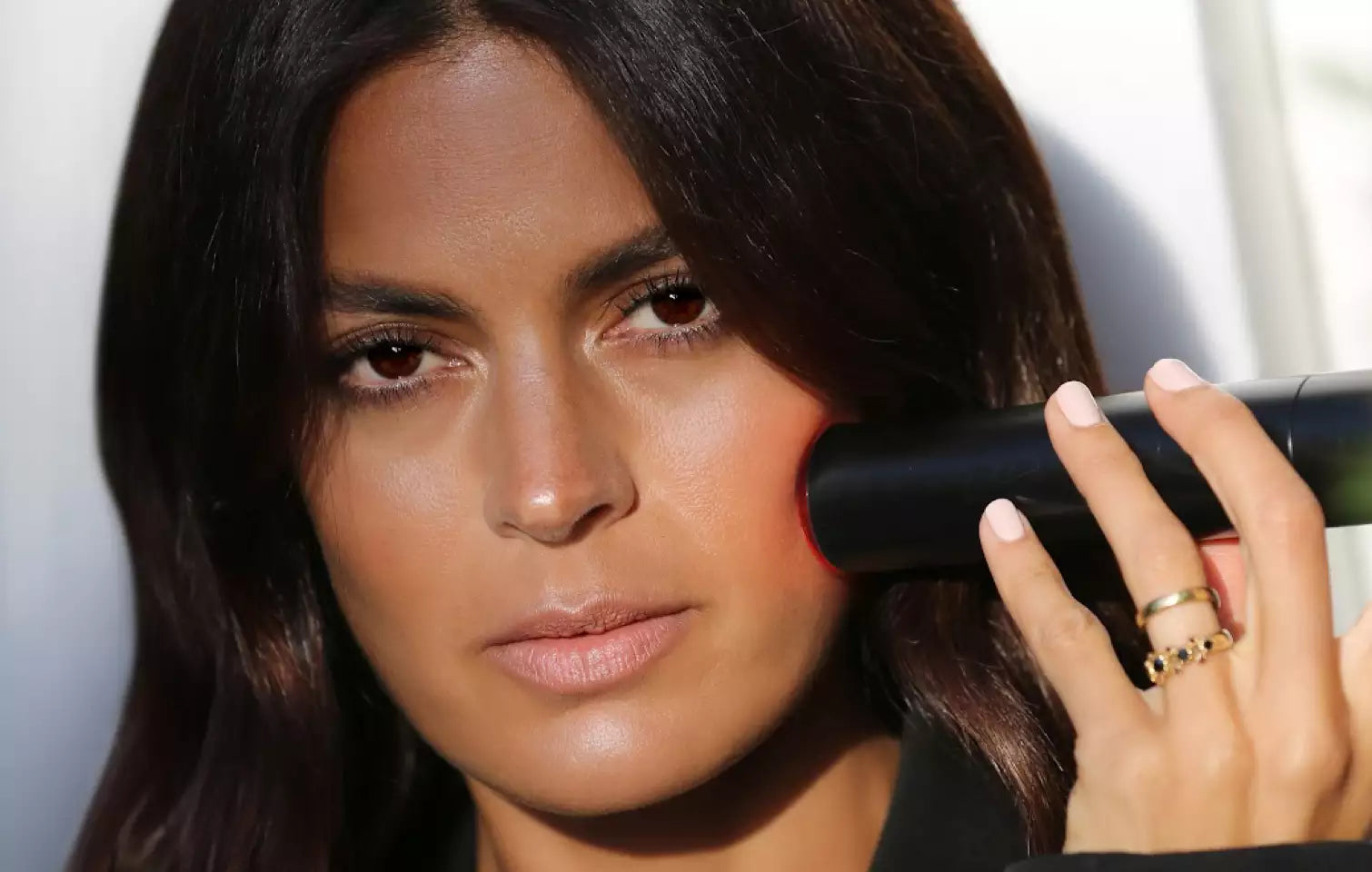 Close-up LYMA red cold laser treatment on face