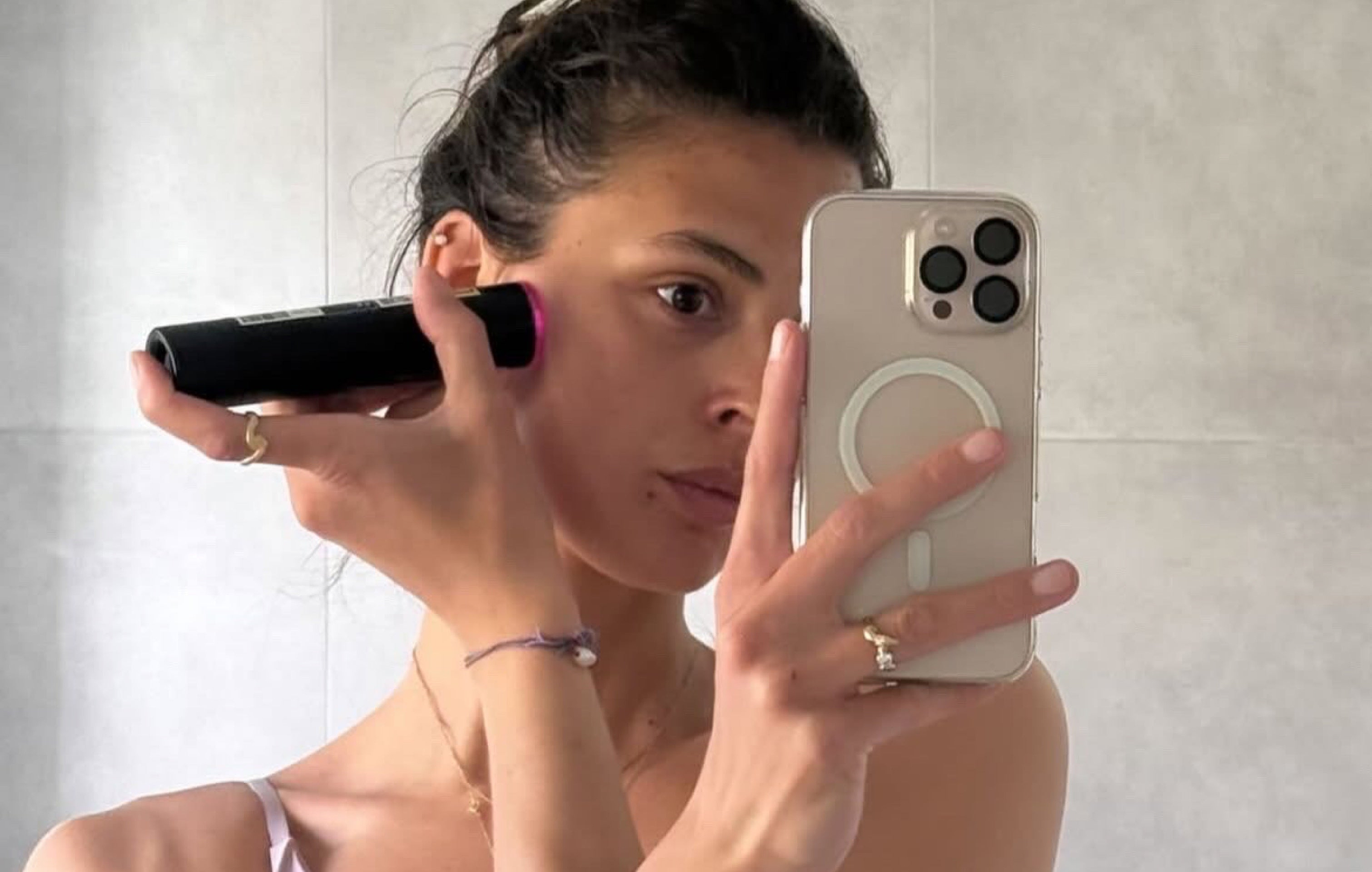 Celebrity using LYMA Laser PRO taking a selfie in Cannes