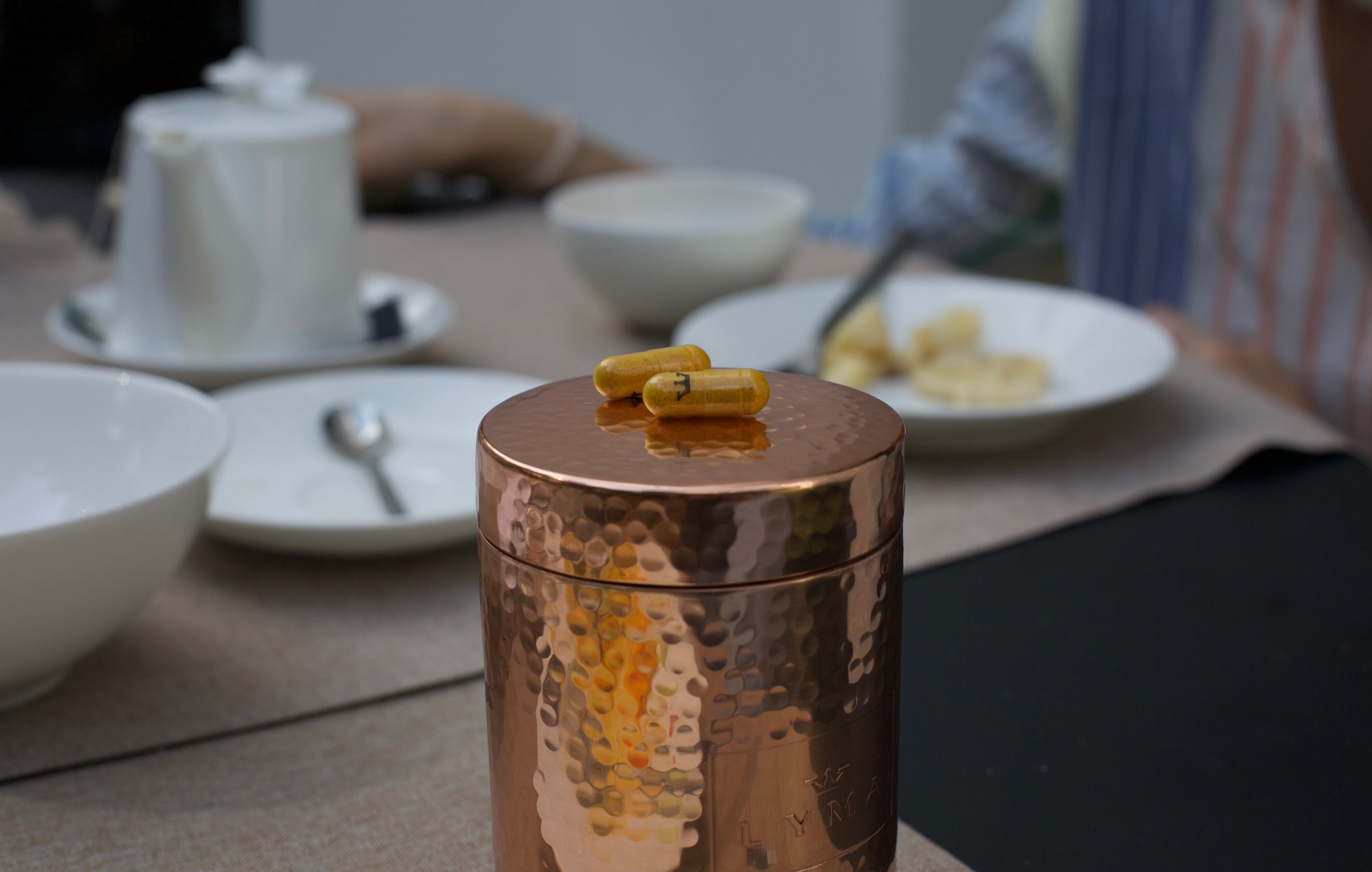 vessel and lyma pills on table