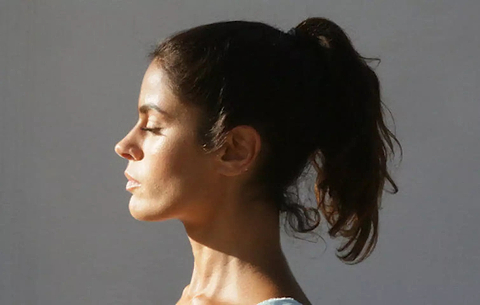 Woman with sculpted jawline using LYMA Laser