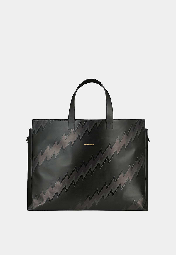 Ashluxe Female Zig Zag Leather Bag in Black with bold black zigzag pattern, structured design, and top handles.