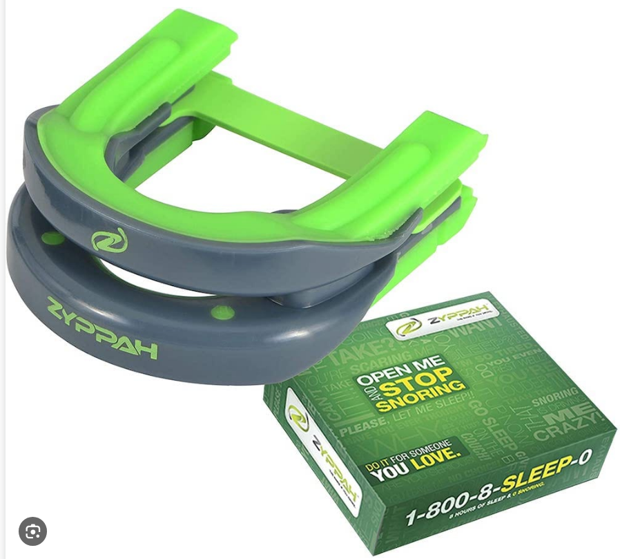 Zyppah anti-snoring mouthpiece showing the elastic tongue strap across the tray