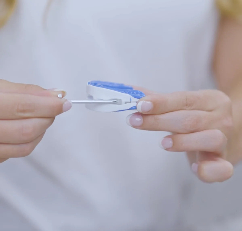 Adjusting the VitalSleep mouthpiece with its key, a no-surgery option for snoring