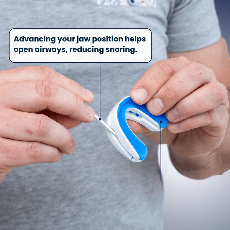 Hands adjusting the VitalSleep mouthpiece to a comfortable jaw setting