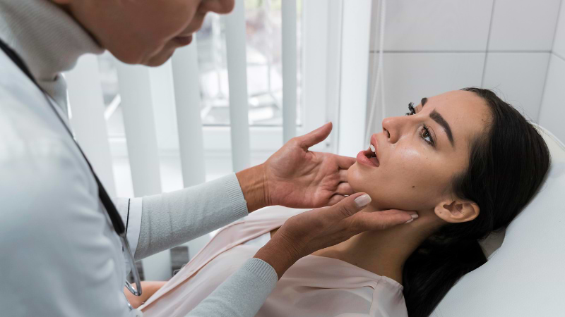 doctor checks woman