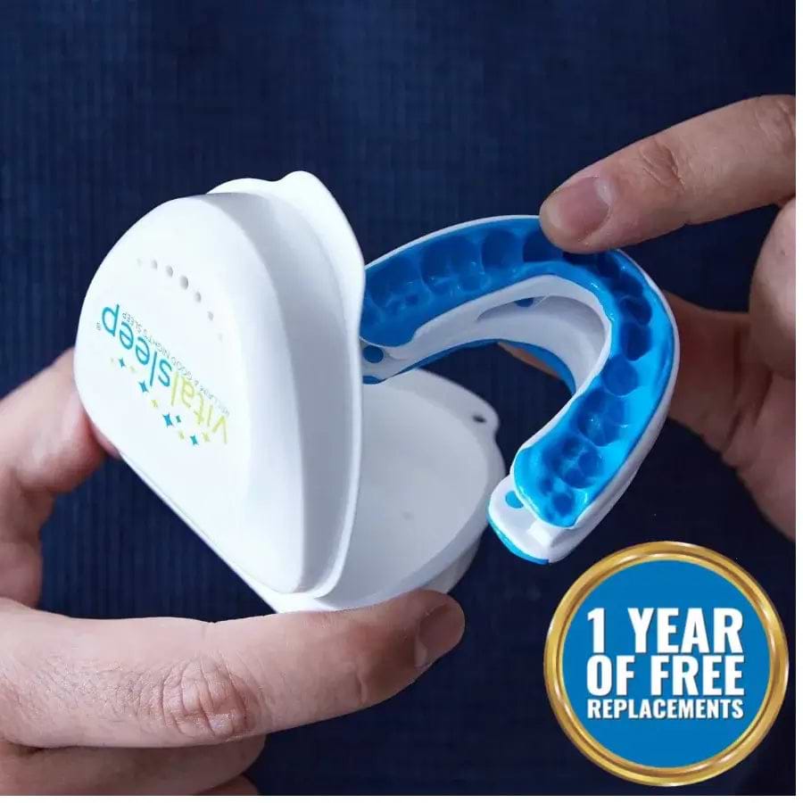 snore guards being held infront of light blue background