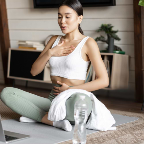 woman doing breathing exercises