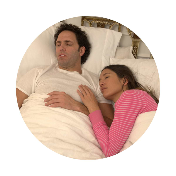 couple sleeping in bed quielty